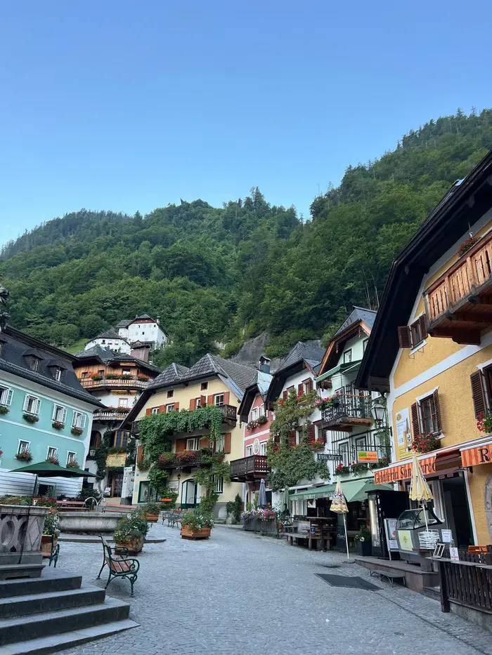 Hallstatt market square with traditional houses and flower balconies