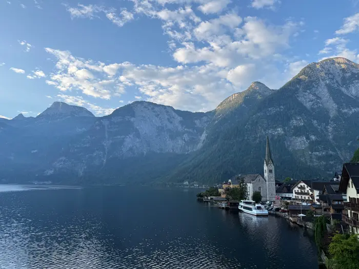 Hallstatt village on the lakeshore beneath the Dachstein mountains in evening light